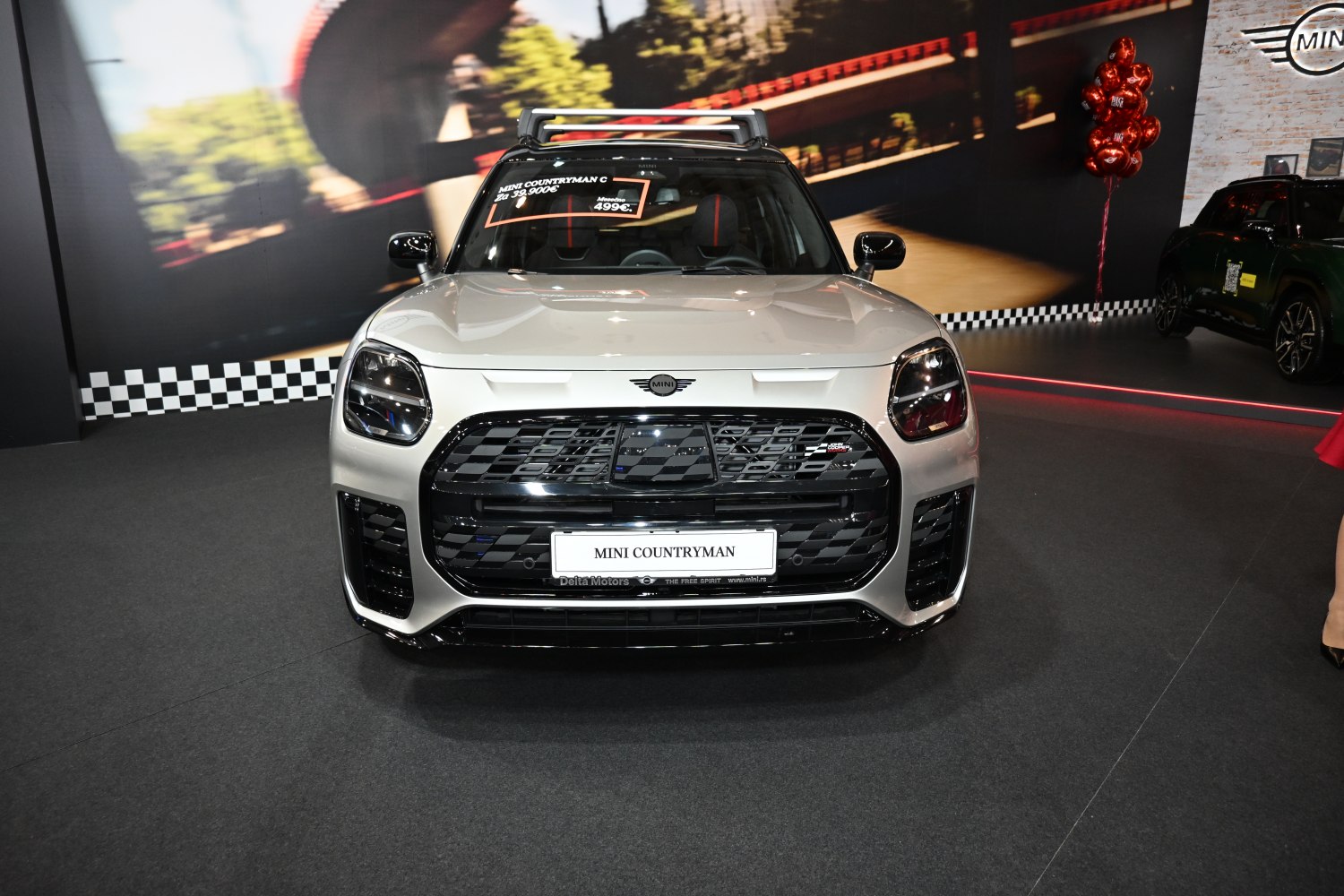 Front view with distinctive headlights and bold black grille.