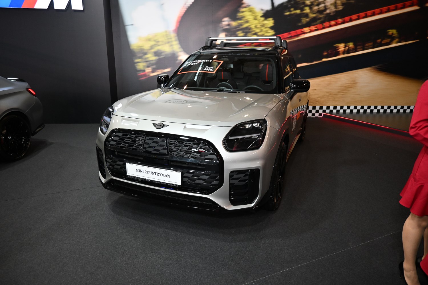 Front view of a 2024 Mini Countryman U25 with black grille and roof rack