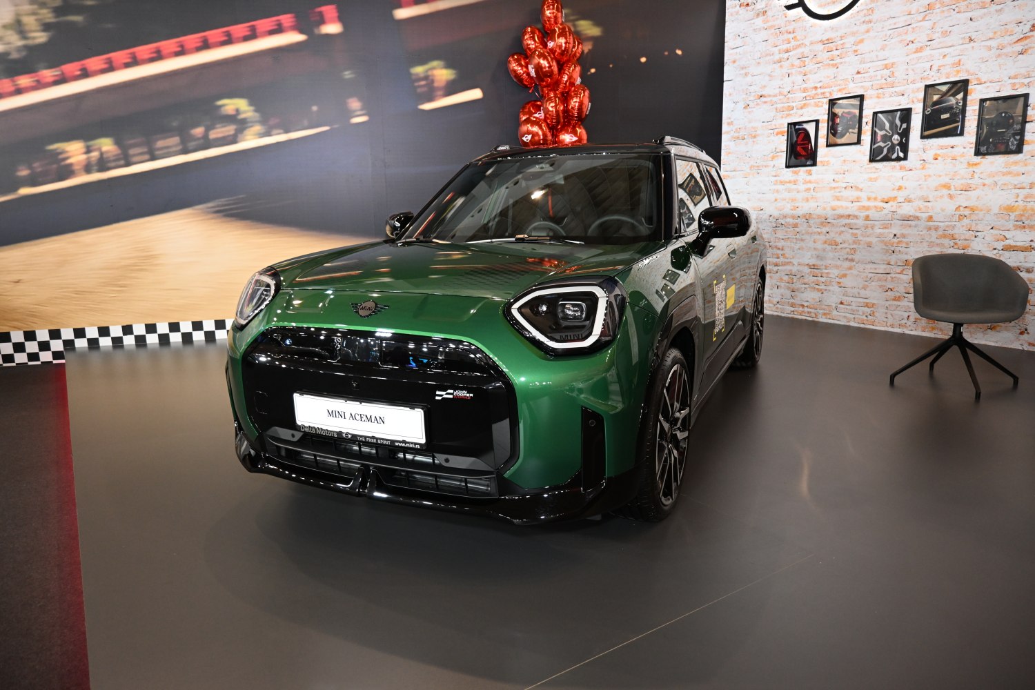 Distinctive LED headlights and bold black grille on green compact SUV front.