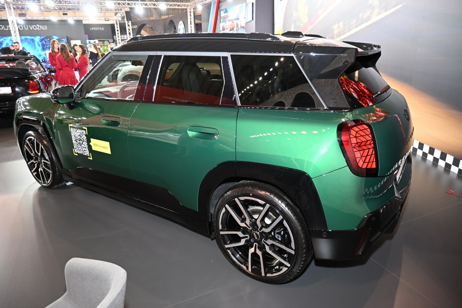 Side and rear view of green Mini Aceman with alloy wheels