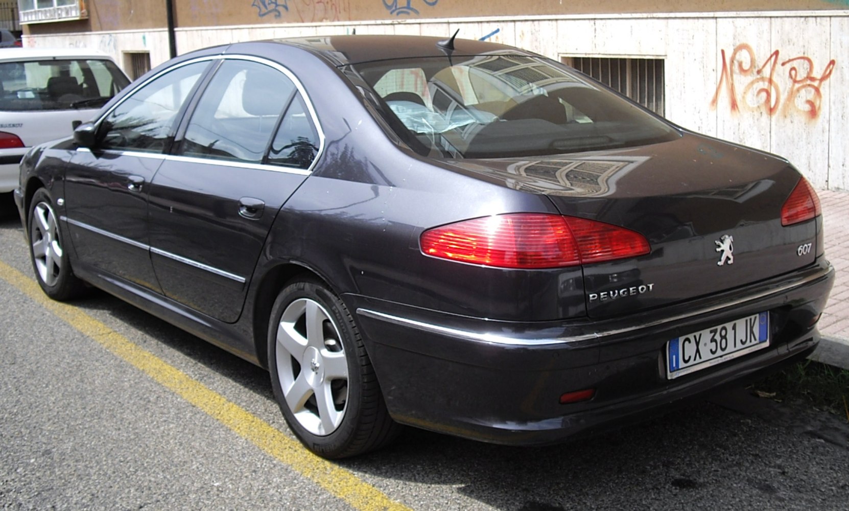 Rear and side profile with distinctive taillights and alloy wheels
