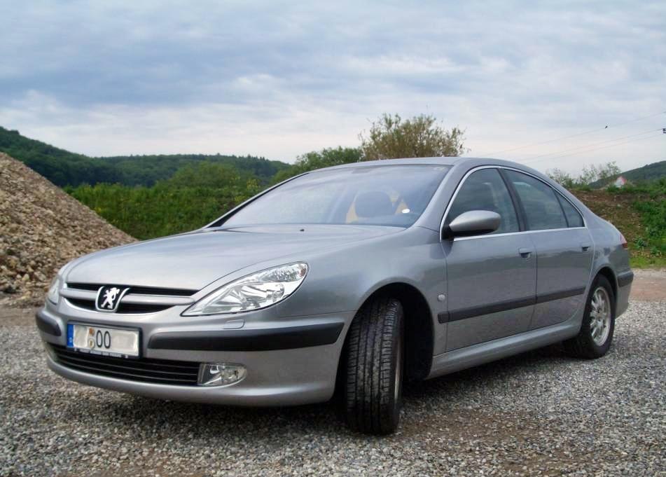 Front-side view of a four-door sedan with smooth body and distinct headlights.