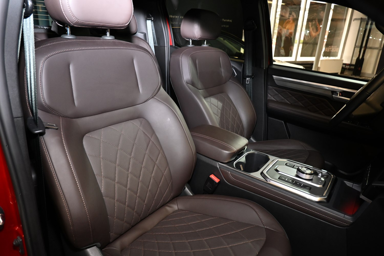 Brown premium leather seats and modern center console with controls