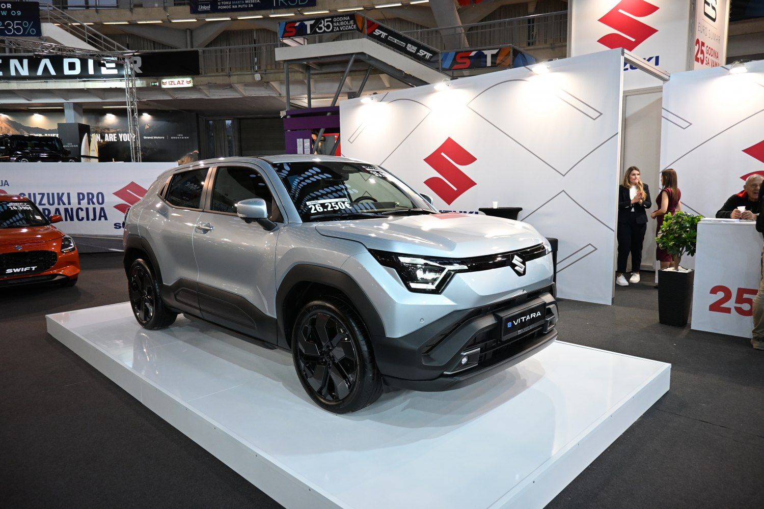Front view of modern compact SUV with LED headlights and black rims