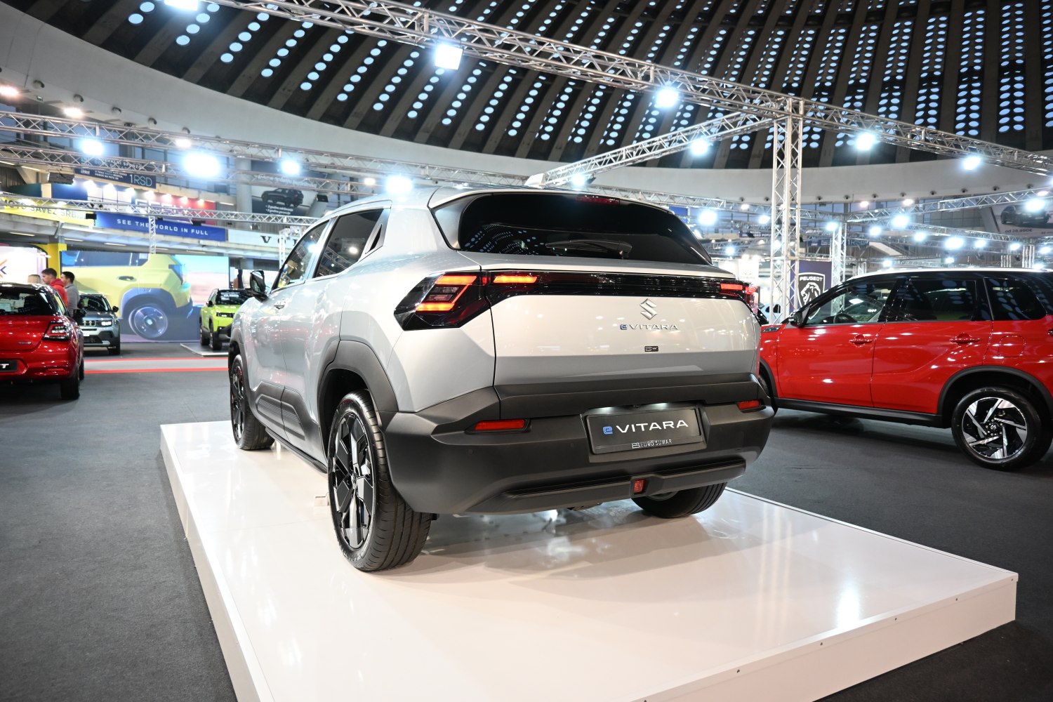 Rear view of modern SUV with sleek LED taillights and black cladding