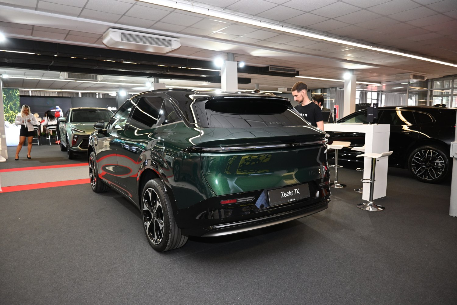 Sleek rear design with black roof and alloy wheels