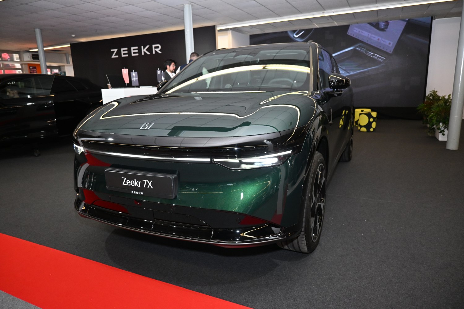 Front view of electric SUV with sleek LED headlights and aerodynamic design