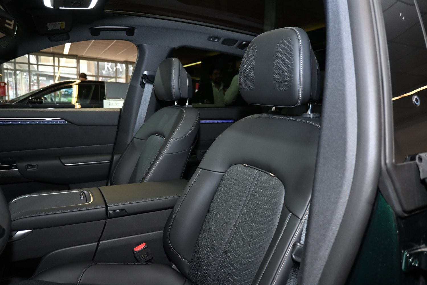 Premium front seats with leather upholstery and detailed stitching