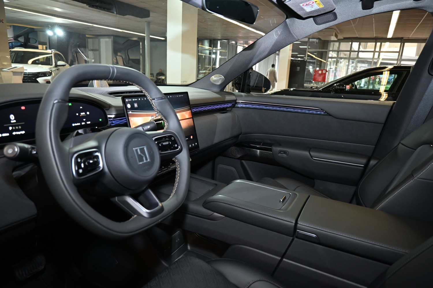 Digital cockpit interior with touchscreen and multifunction steering wheel