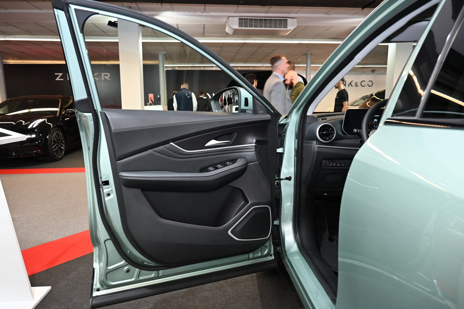 Interior door panel and dashboard details with controls and speaker