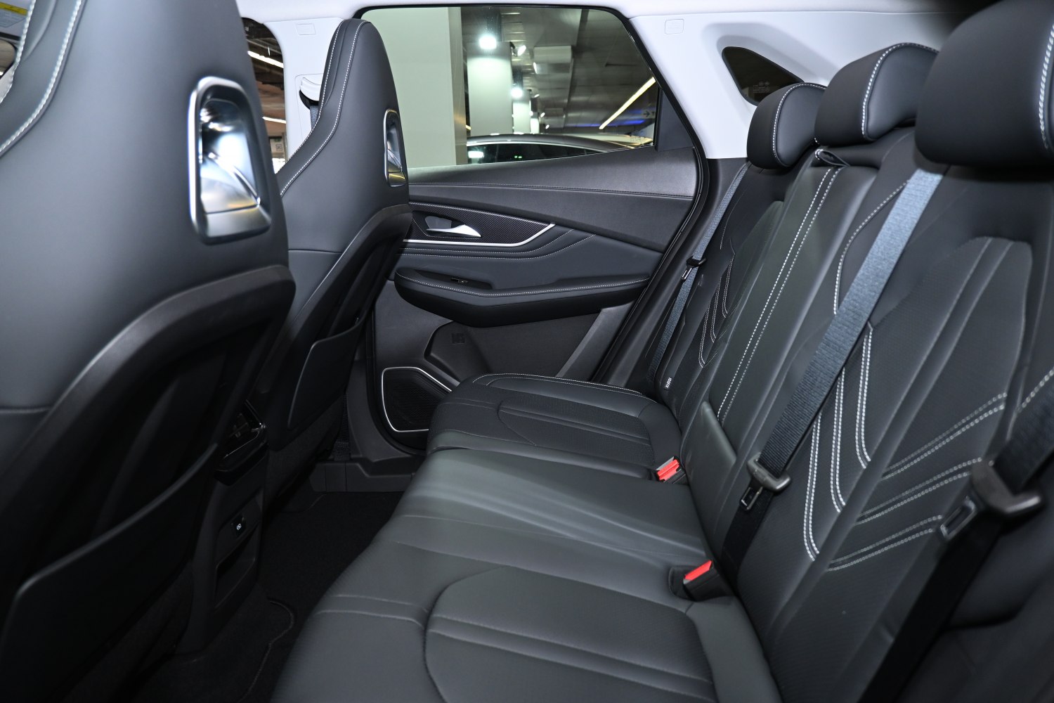 Spacious rear seats with black upholstery and contrast stitching