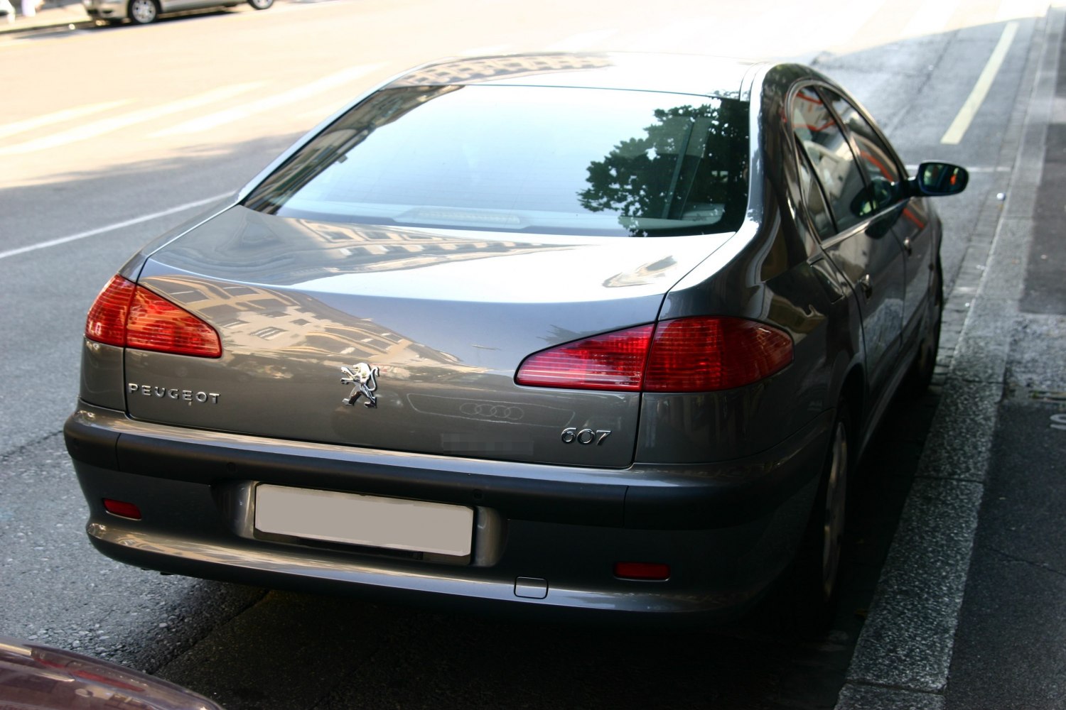 Rear view with distinctive tail lights and smooth trunk design.
