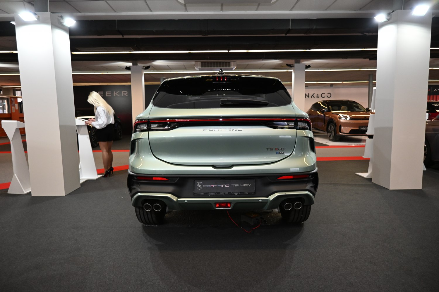 Rear view with sleek taillights and dual exhaust system