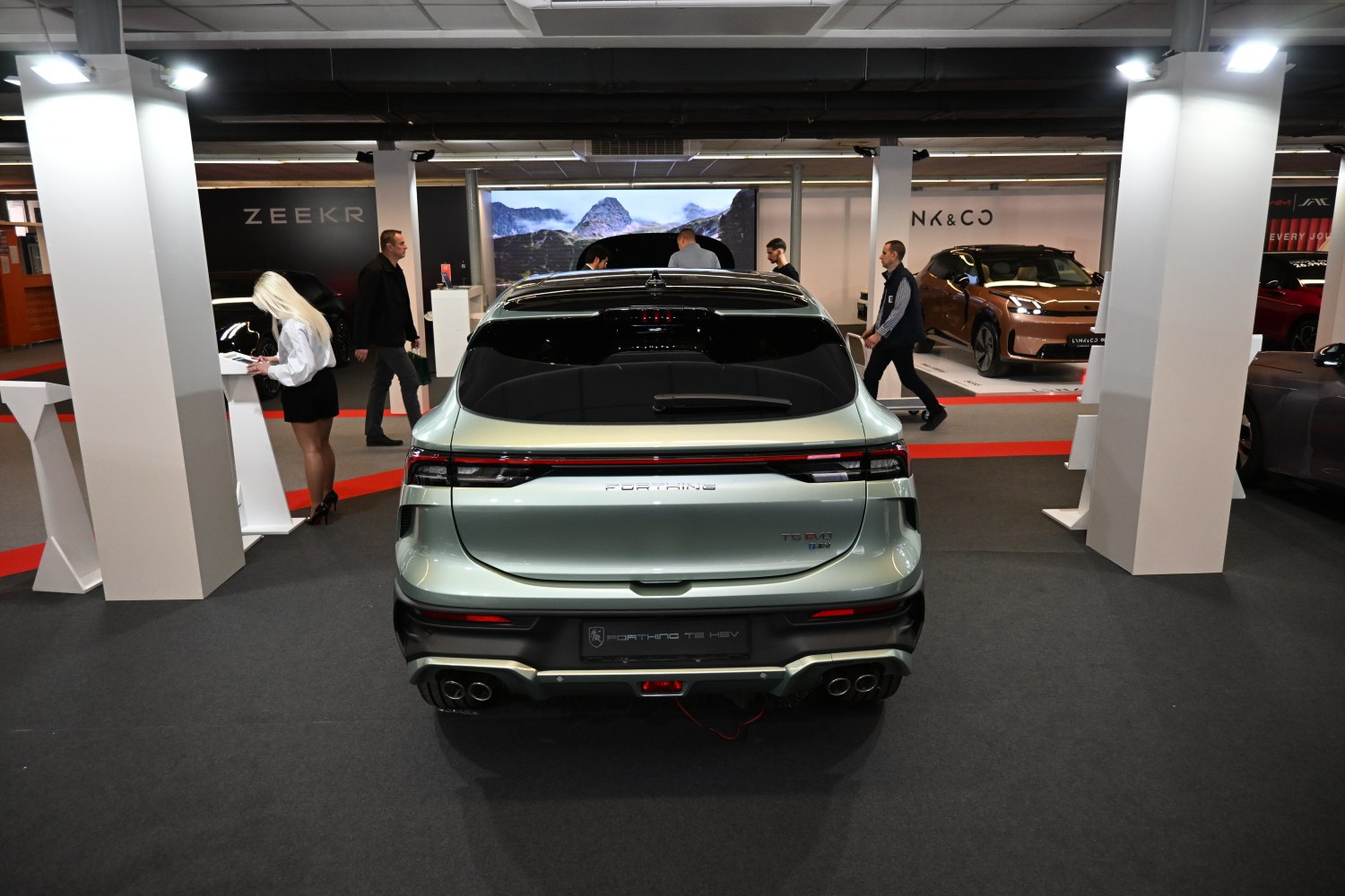 Sleek rear design with quad exhaust tips and modern taillights