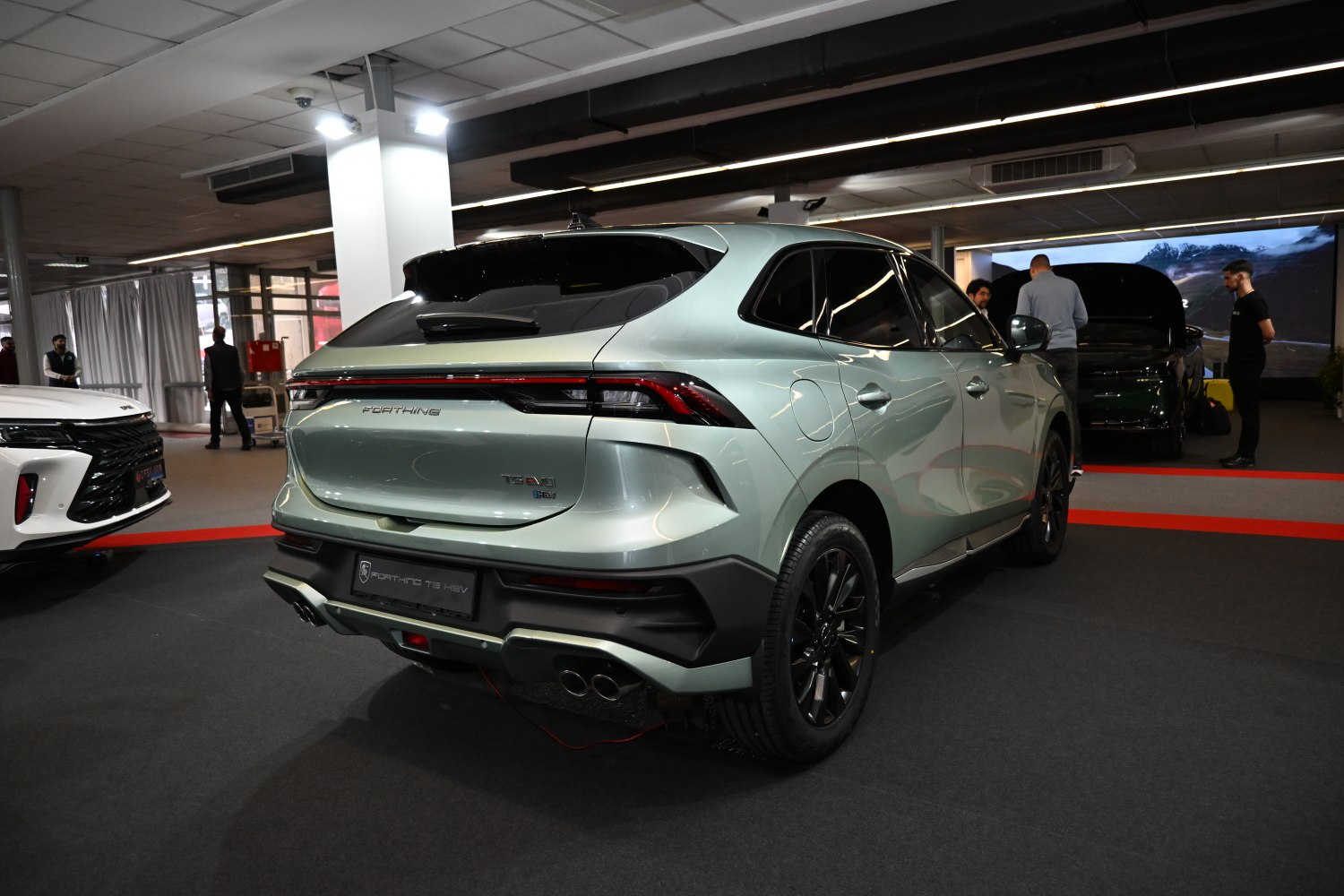 Rear and side view of modern SUV with dual exhaust and sleek tail lights