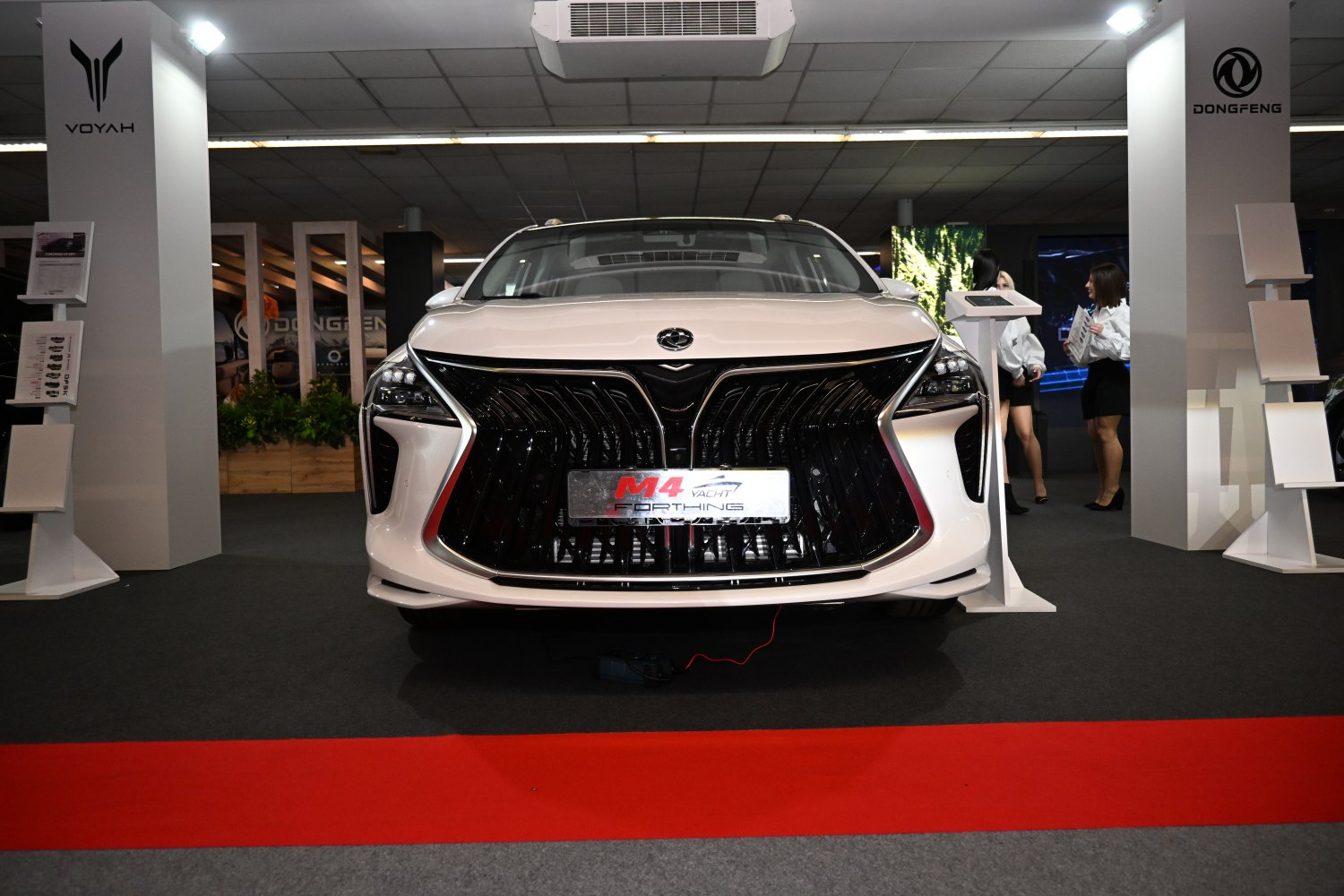 Large intricate front grille with modern LED headlights
