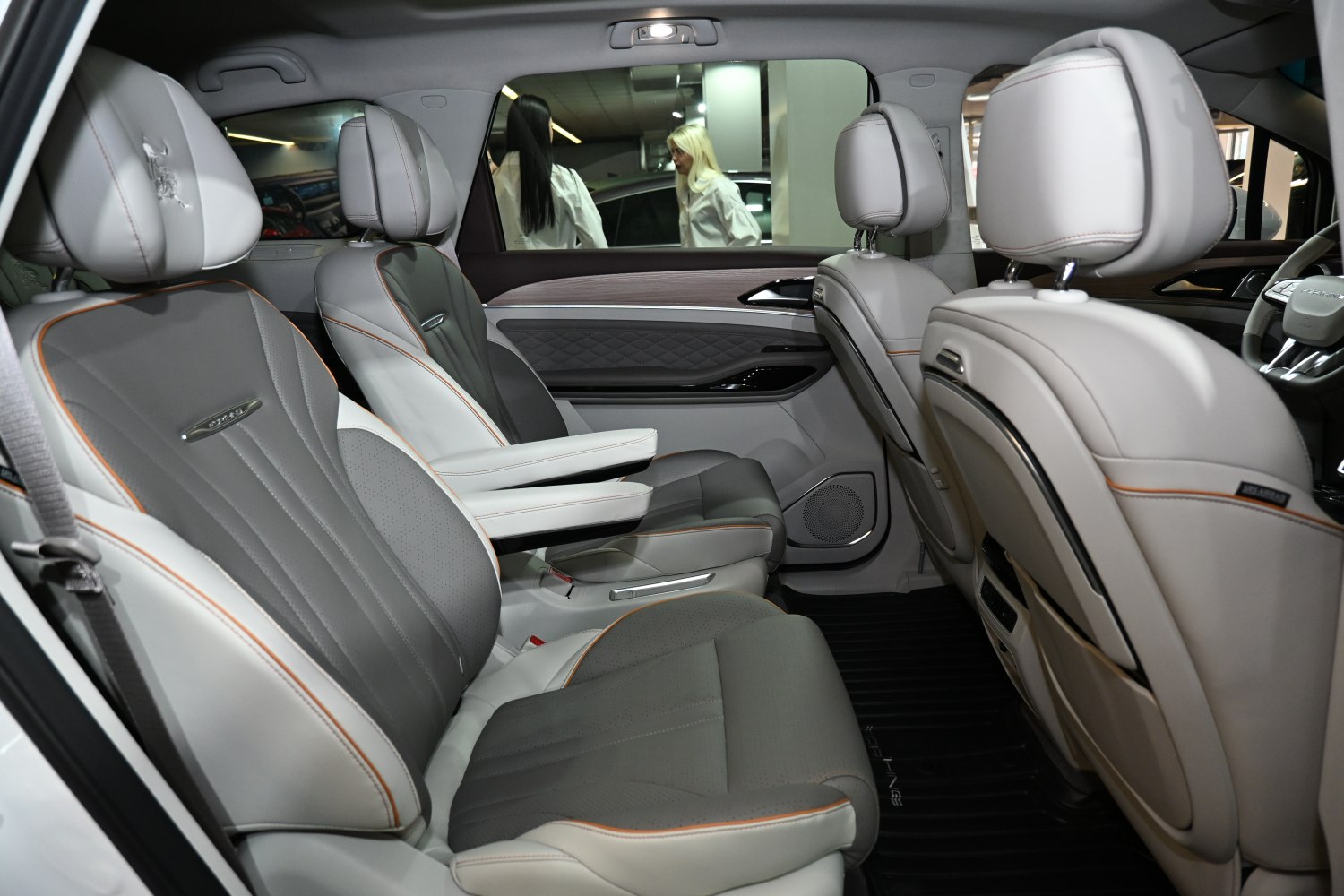 Premium leather interior seats with armrests and detailed stitching