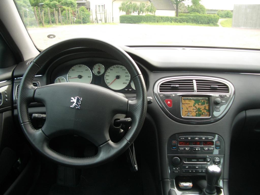 Leather steering wheel and dashboard with instrument cluster and navigation screen