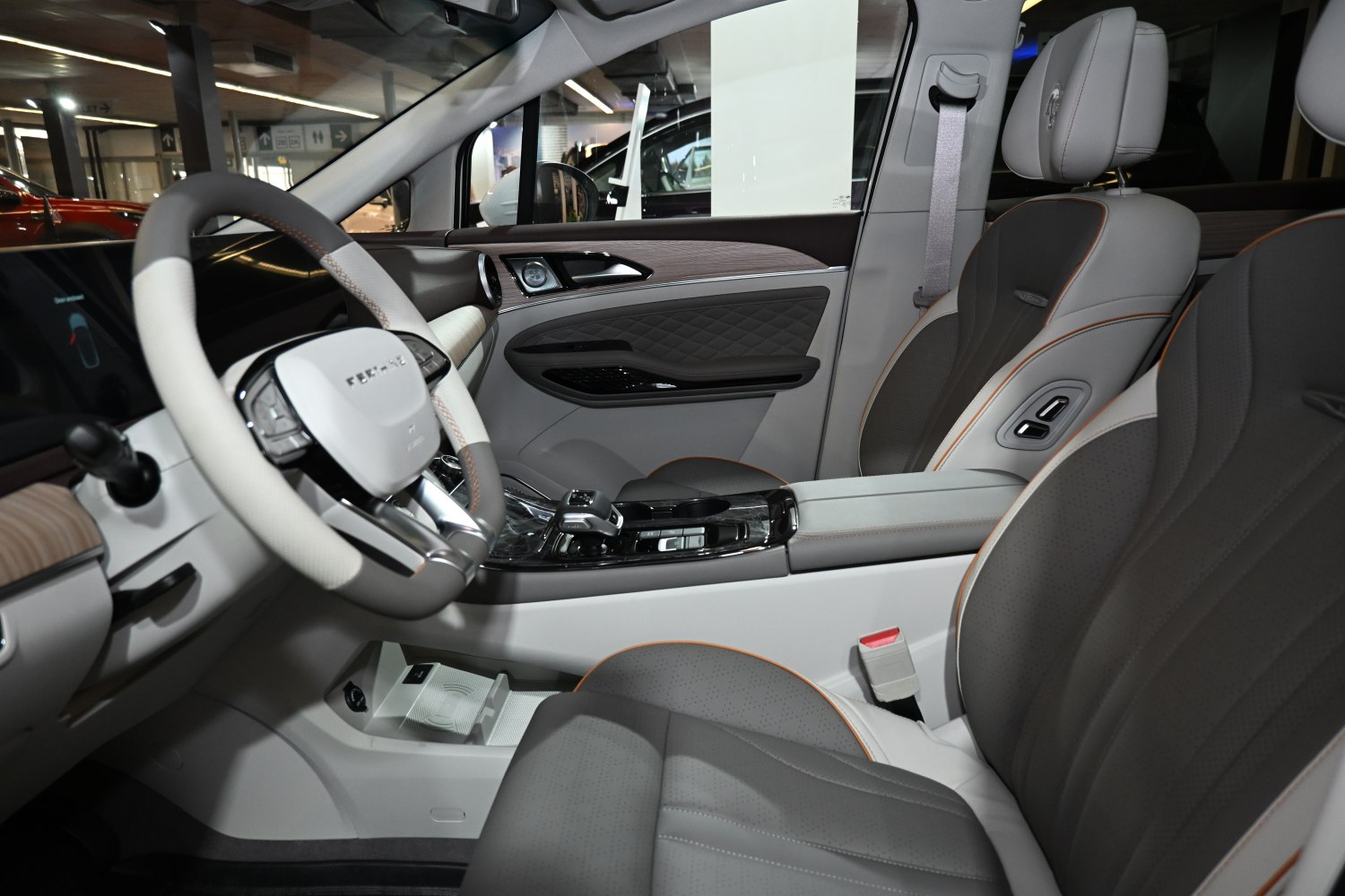 Steering wheel and plush leather seats with detailed finishing