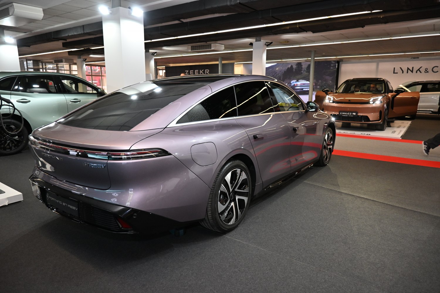Sleek rear with full-width tail lights and smooth aerodynamic design.