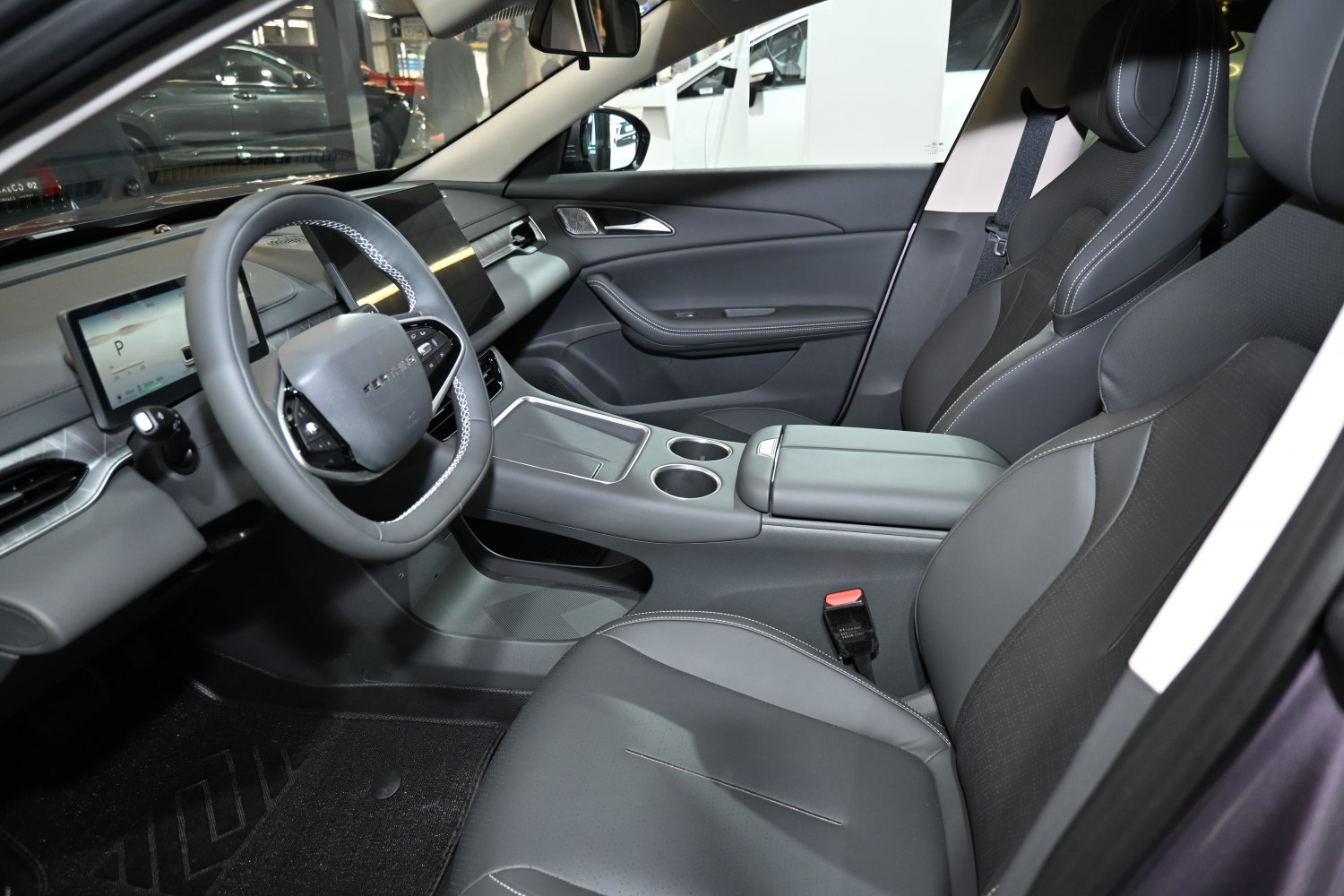 Modern car interior with digital displays and ergonomic seats