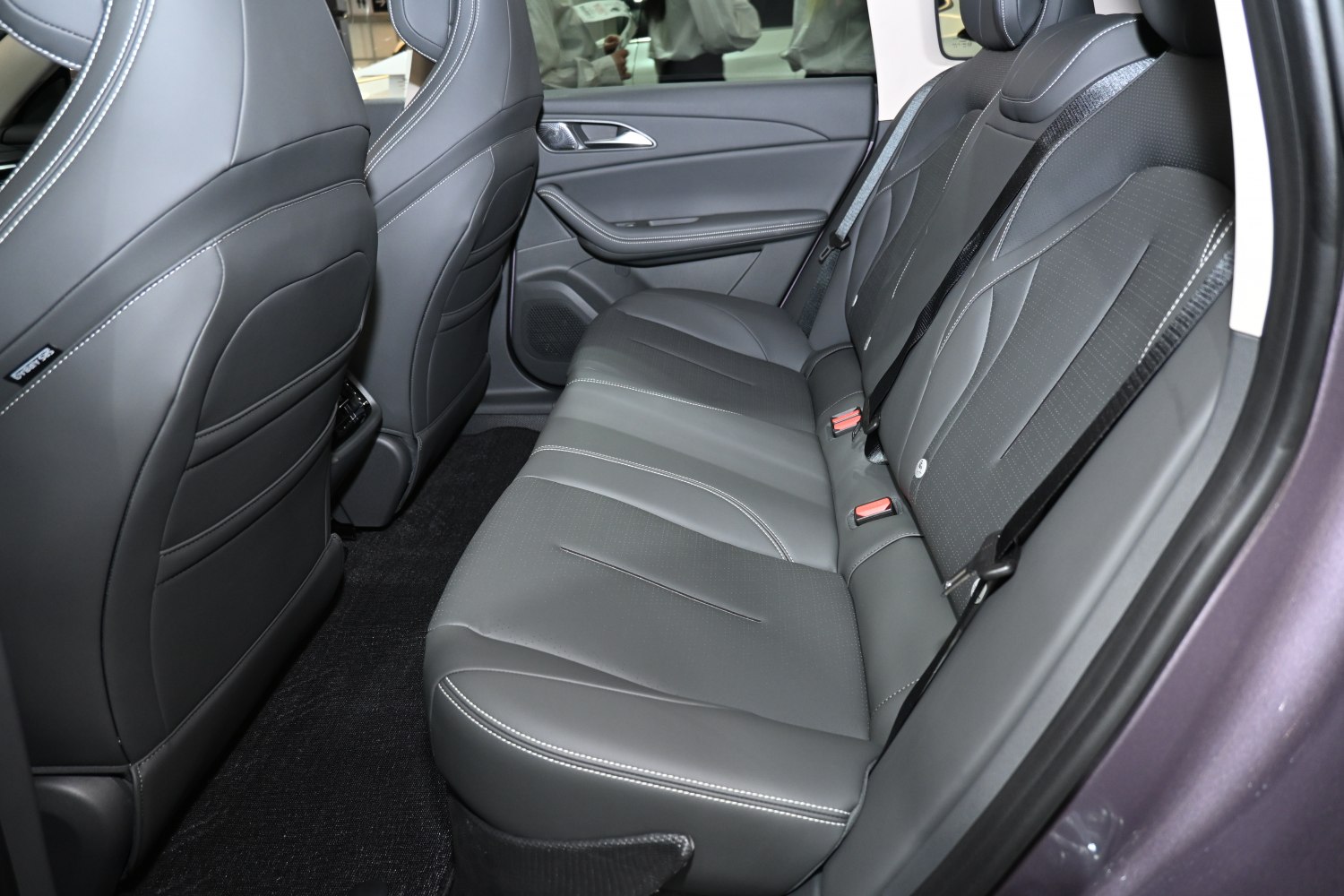 Rear seat with premium black leather upholstery and stitching
