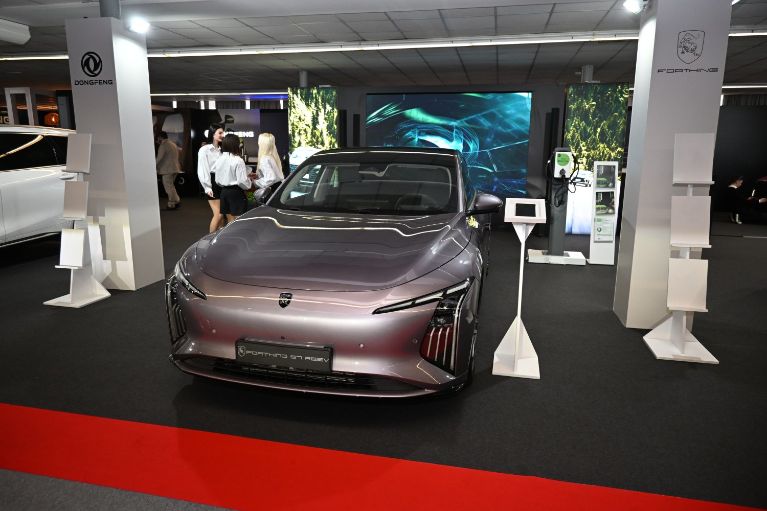 Sleek front view of an electric sedan with LED headlights and aerodynamic body