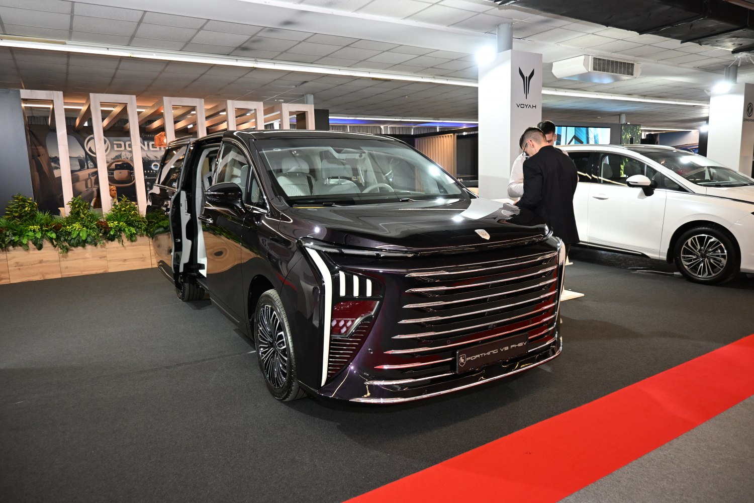 Modern front grille and rear sliding doors of luxury minivan
