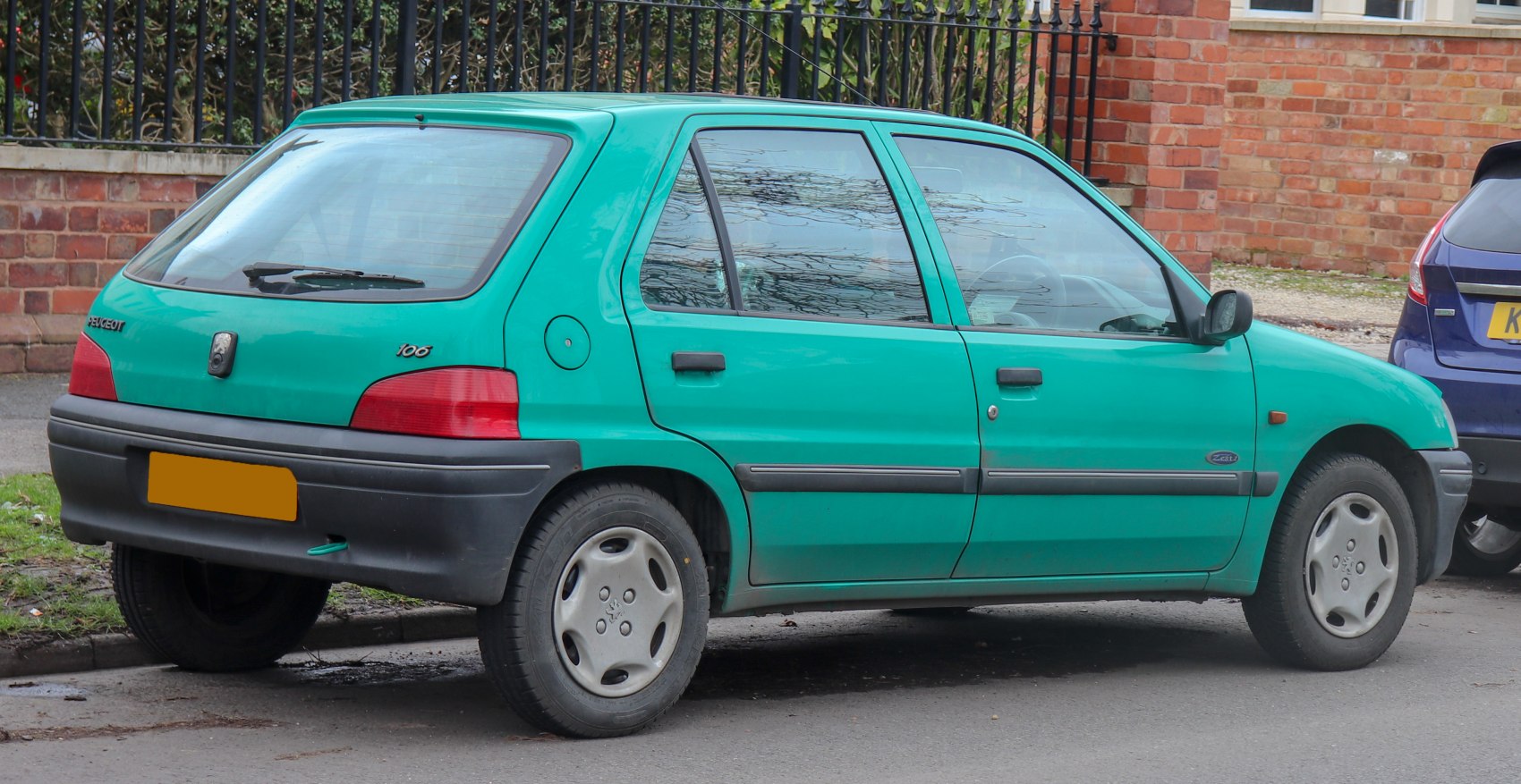 Compact green hatchback with visible side and rear design features.