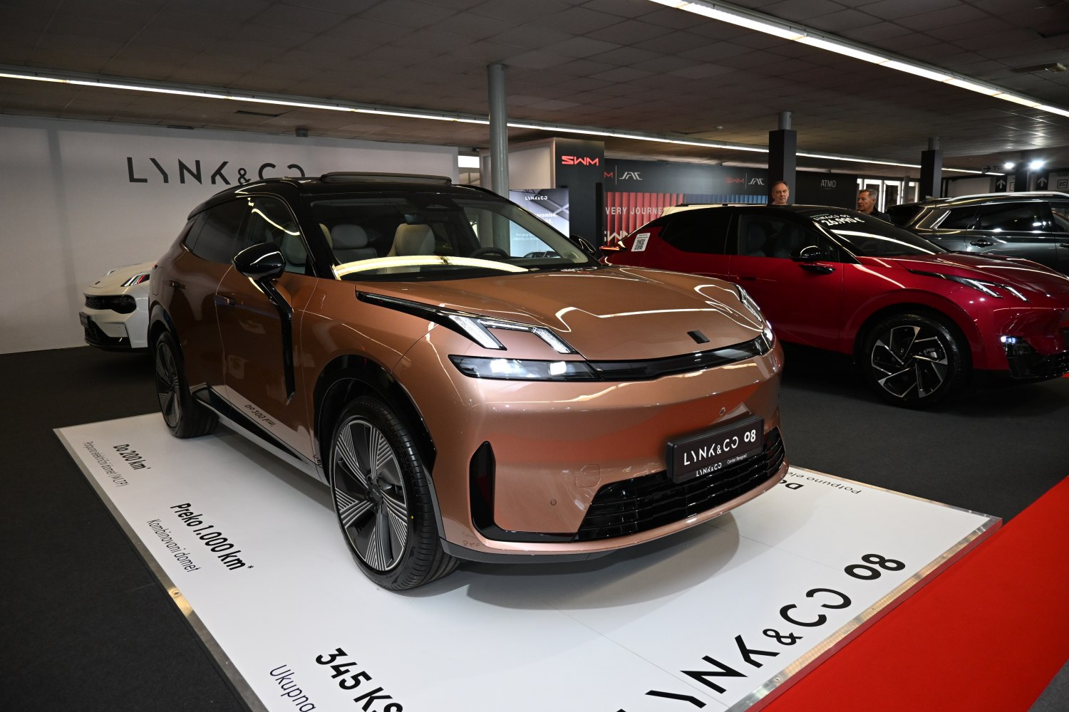 Front three-quarter view with LED headlights and prominent alloy wheels