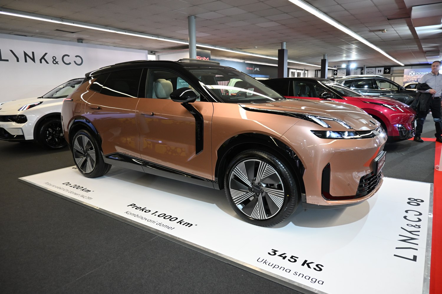 Copper electric SUV with sleek front and large wheels