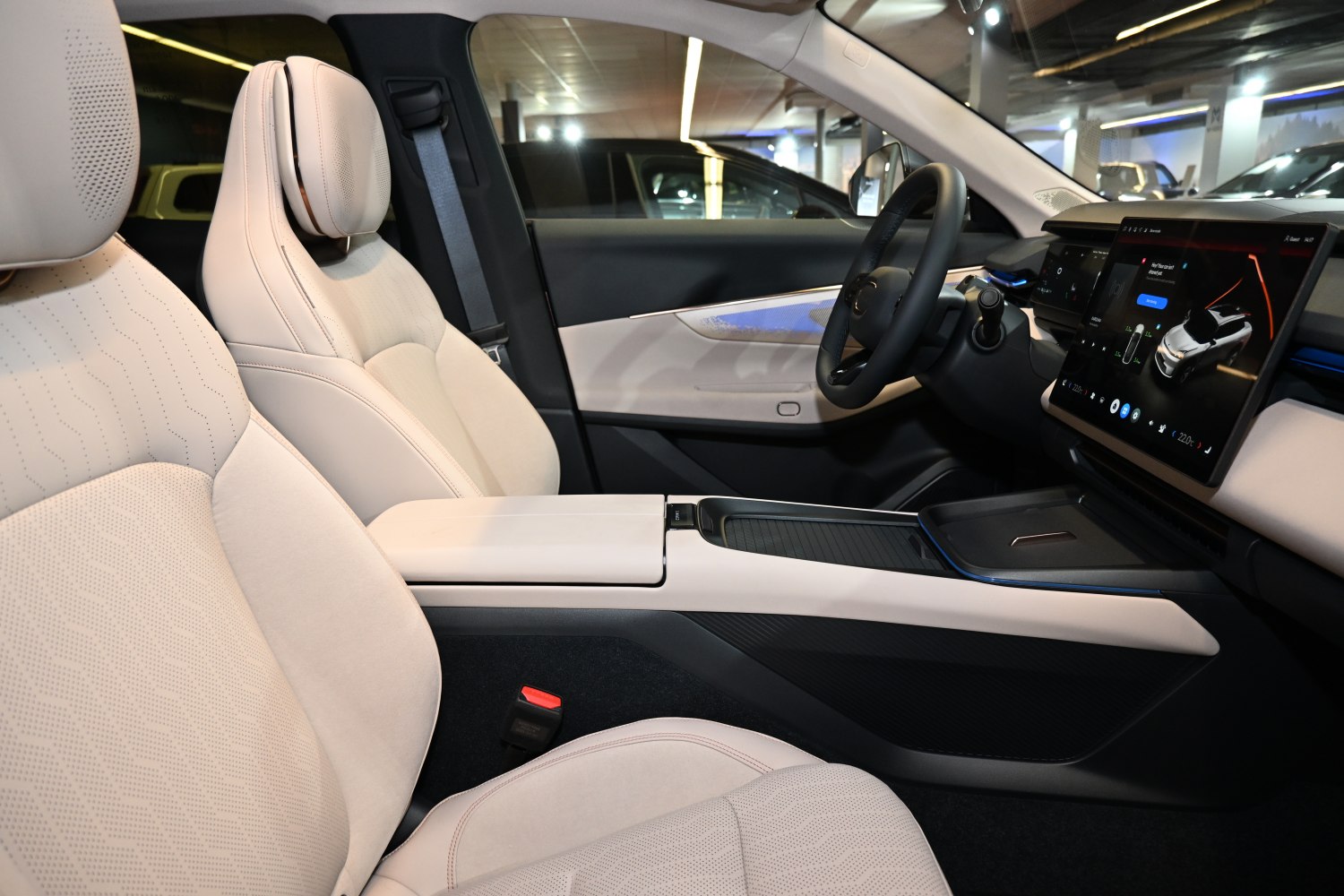 Beige perforated seats with digital dashboard and touchscreen infotainment