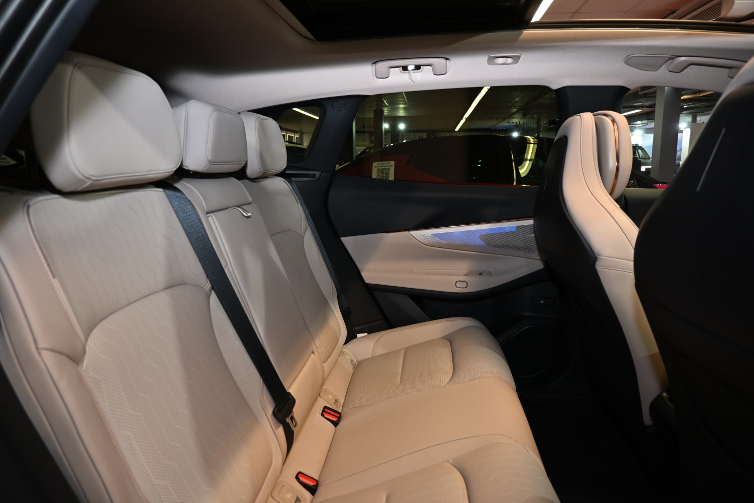 Beige rear seat with headrests and spacious cabin