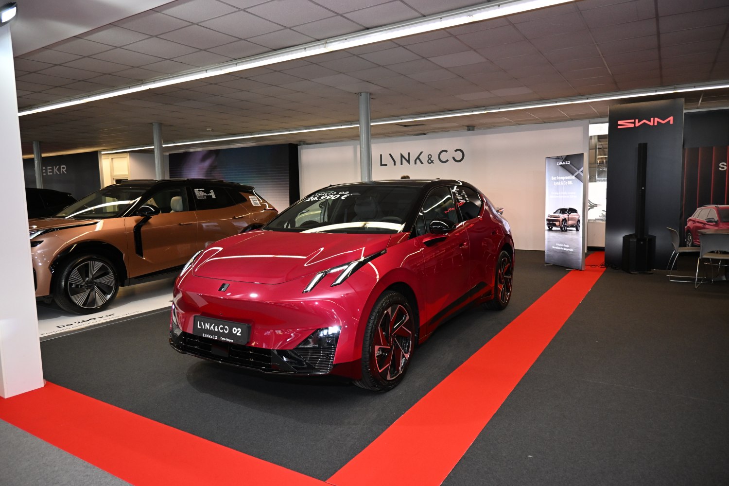 Futuristic electric compact vehicle with sleek LED headlights and alloy wheels.