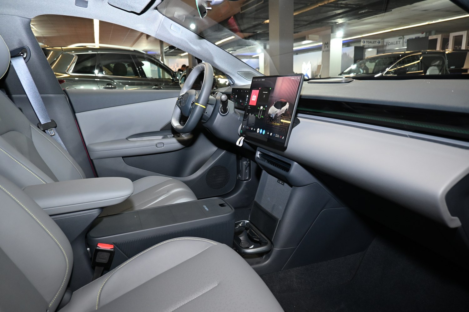 Digital dashboard with touchscreen and minimalist interior design.
