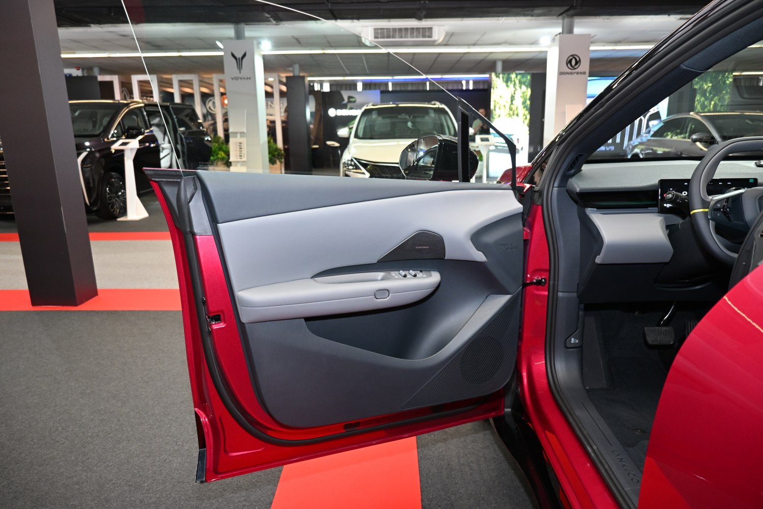 Modern interior door panel with integrated control switches and speaker grille