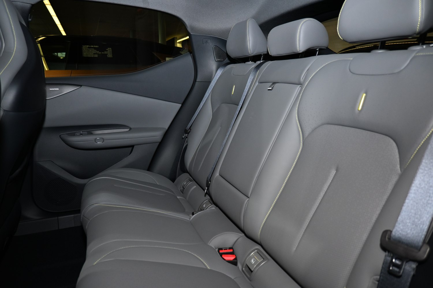 Premium rear seat interior with grey upholstery and seatbelts