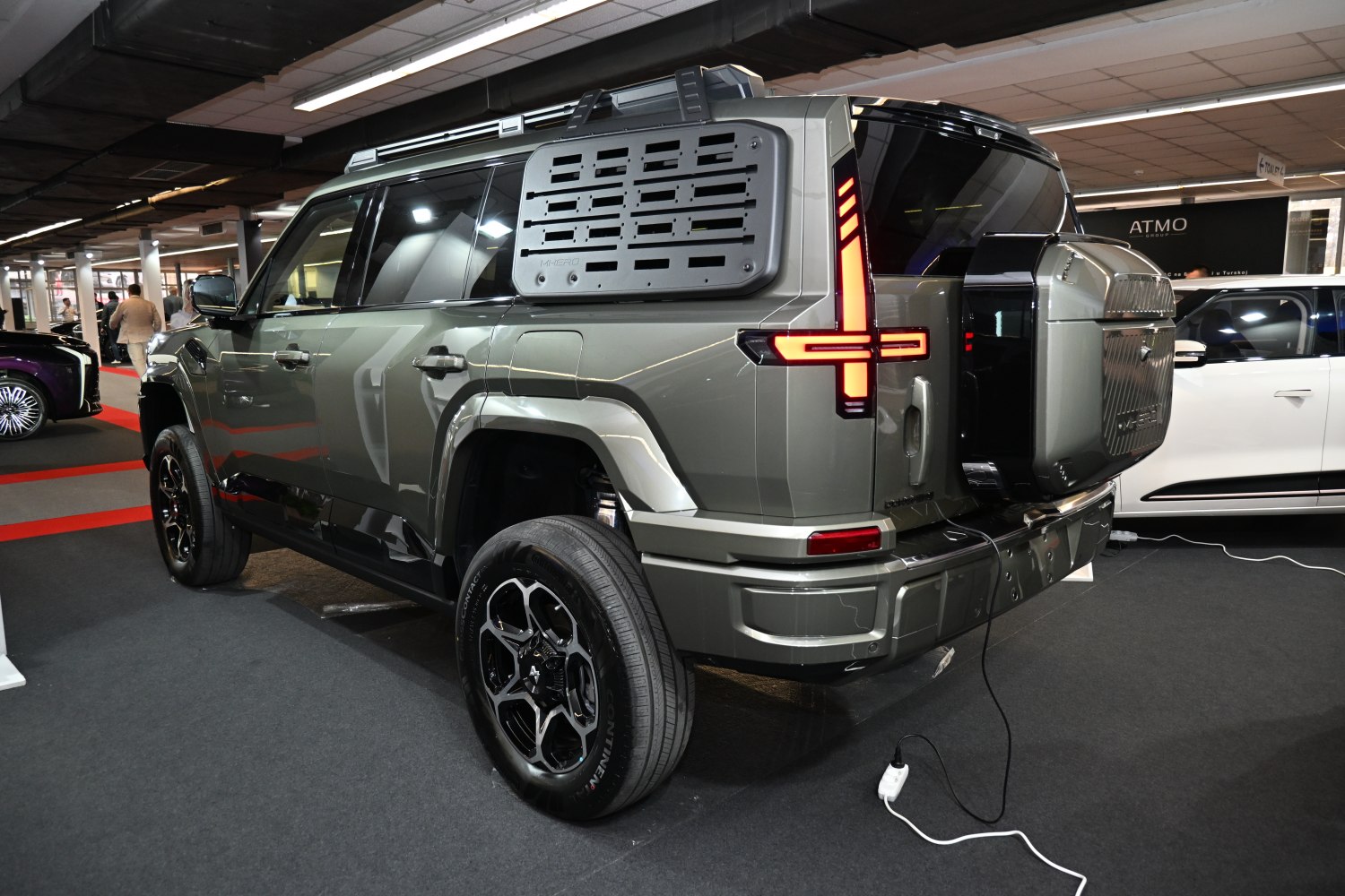 Rear view of SUV with bold taillights and rugged side panel.