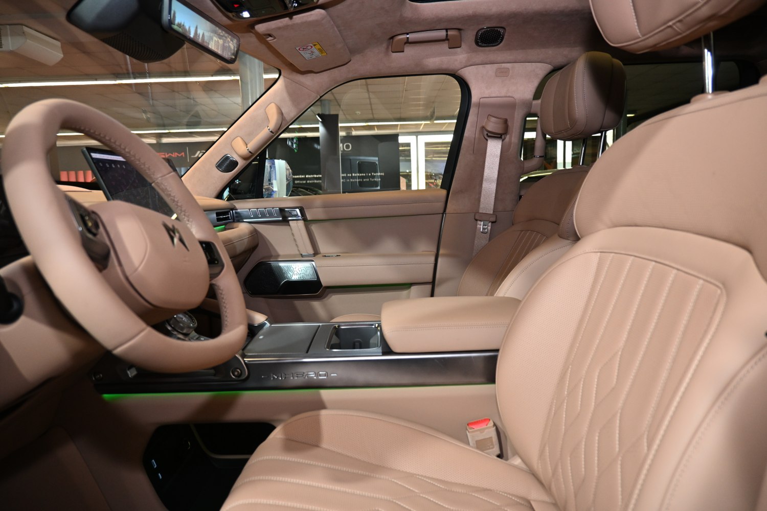 Luxurious beige leather interior with advanced dashboard and ergonomic seats
