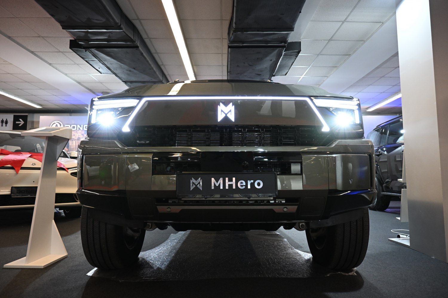 Front view with LED headlights and bold grille
