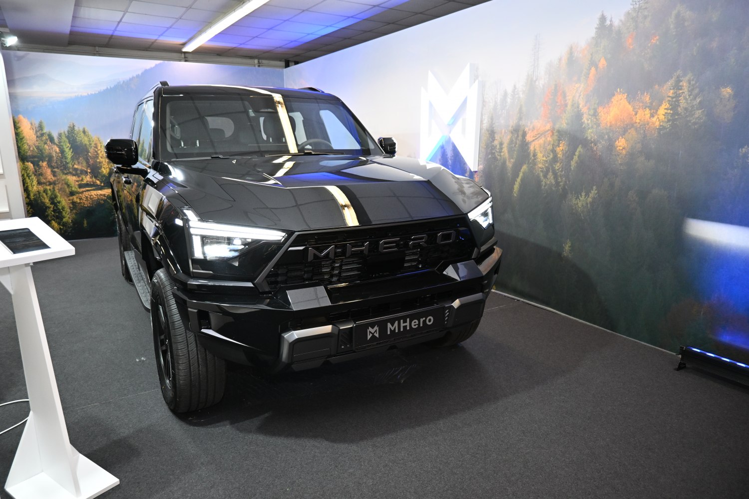 Modern electric SUV with bold grille and LED headlights