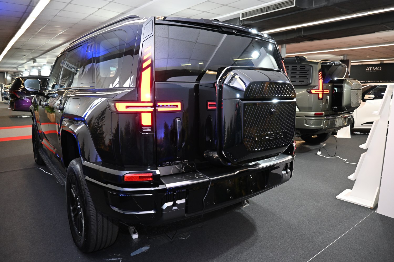 Rear of SUV with distinctive LED tail lights and spare tire mount