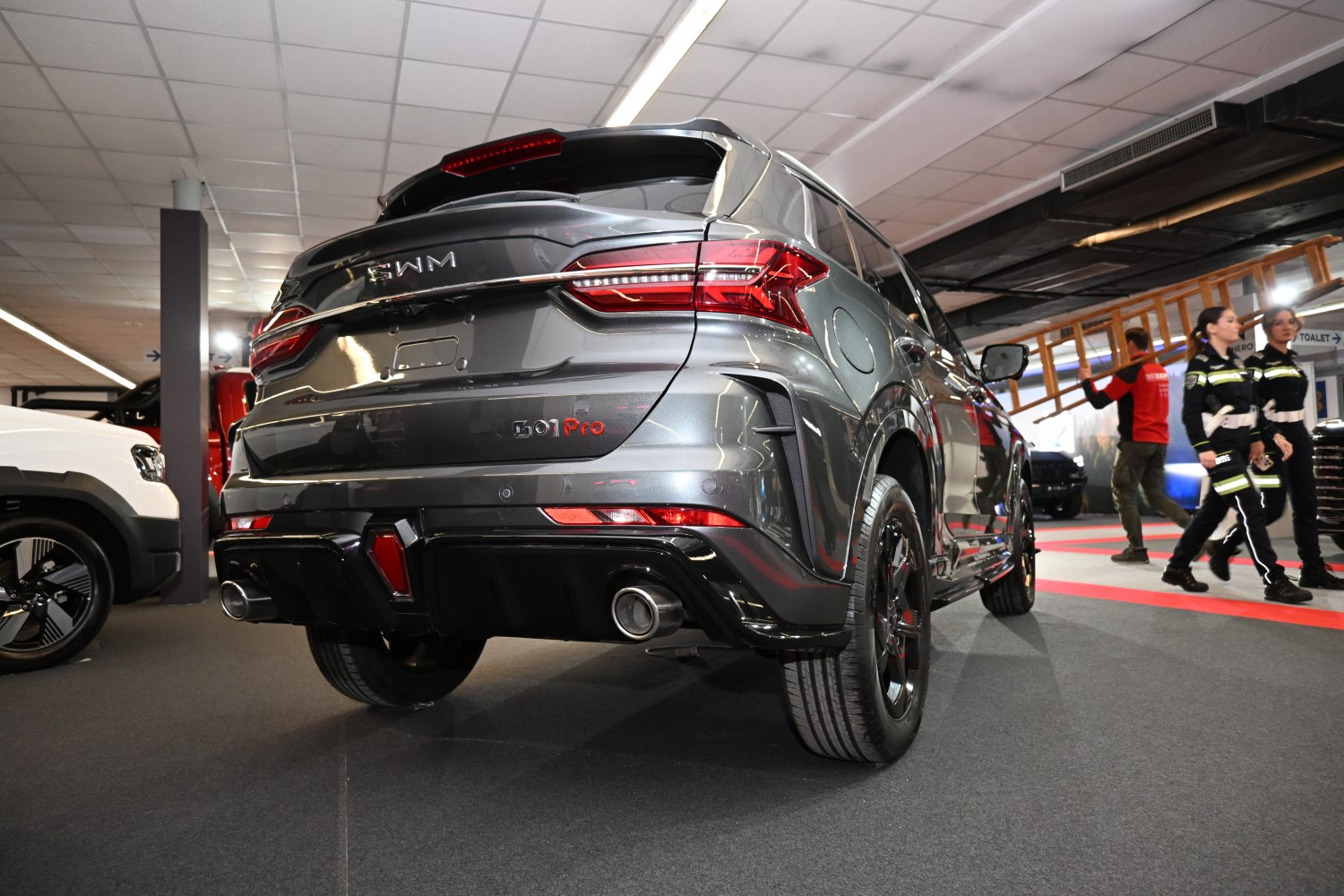 Rear view of an SUV with LED taillights and dual exhaust pipes