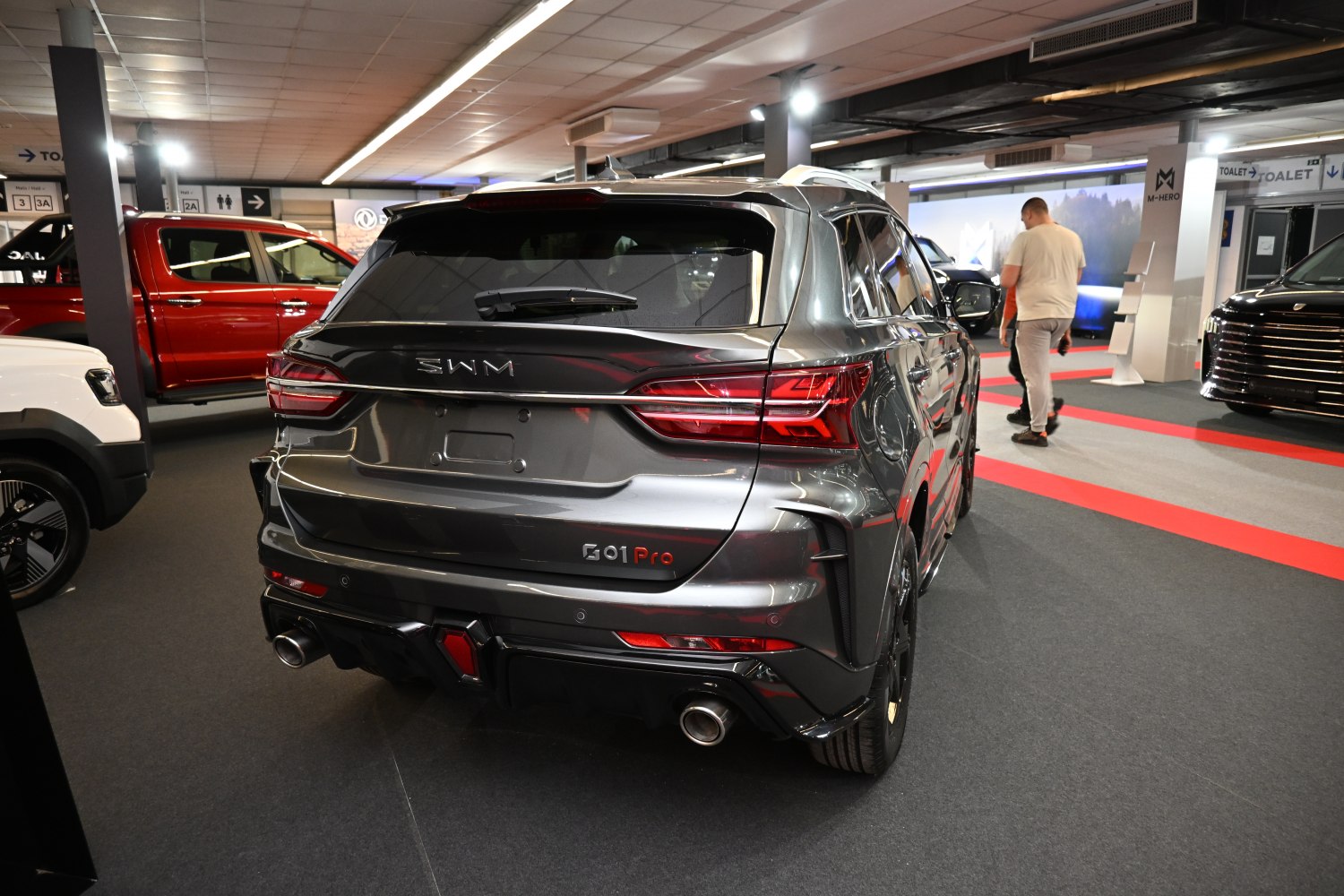 Rear SUV view with sporty dual exhausts and modern taillights