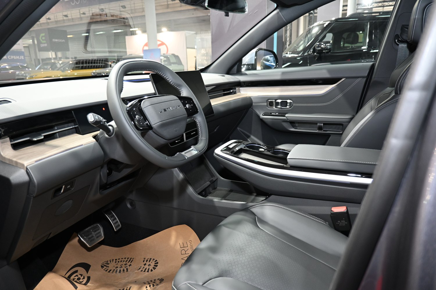 Modern digital dashboard and leather seats inside vehicle cabin