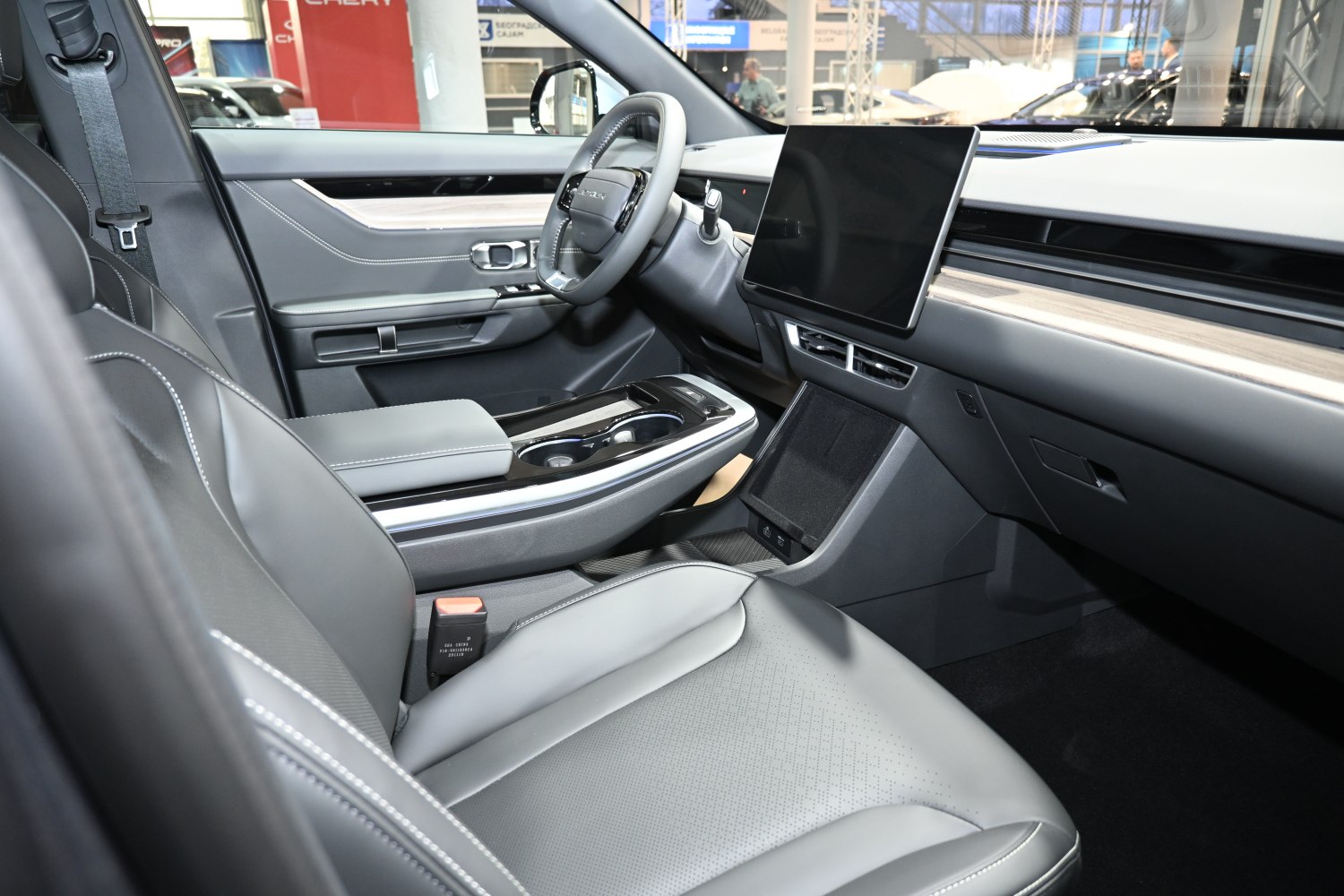 Modern car interior with large touchscreen and leather seats