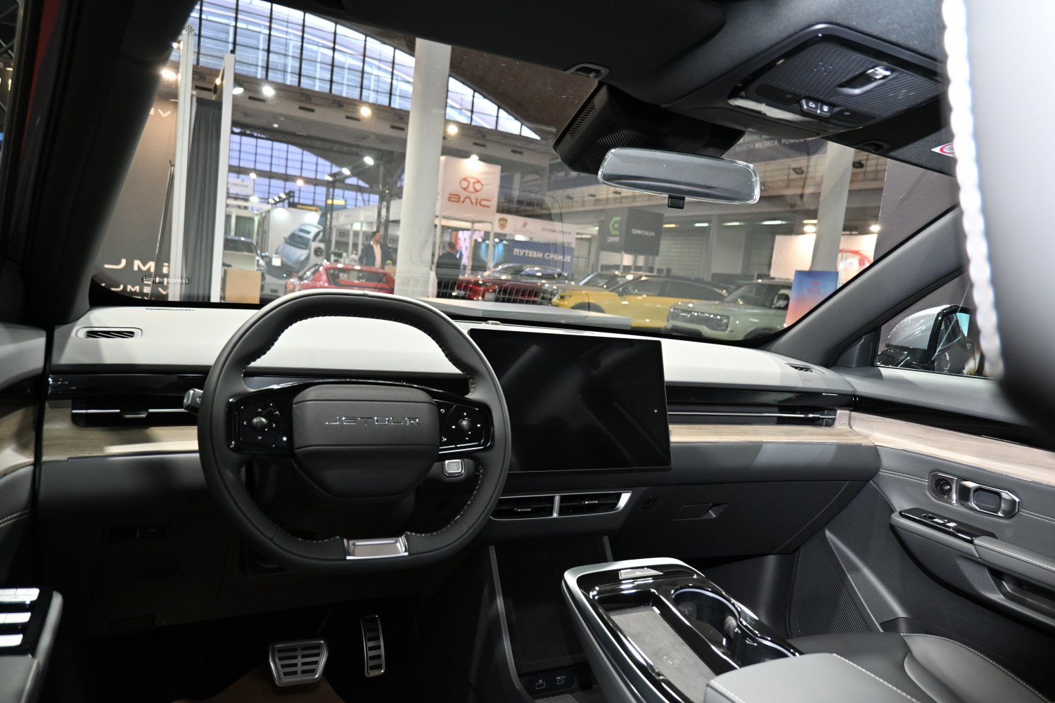 Steering wheel and digital dashboard with touchscreen display in car interior