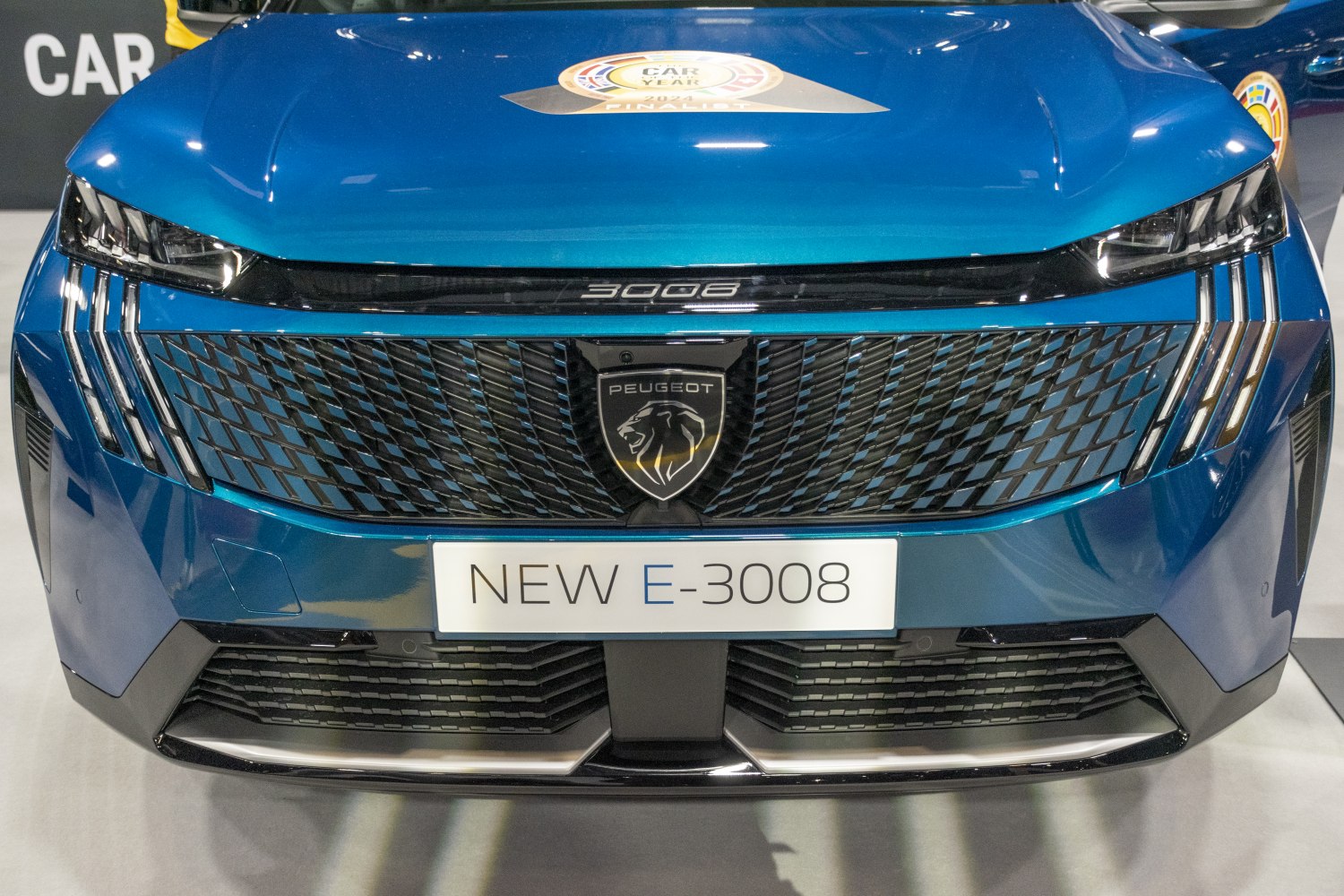 Modern front grille and sharp multi-segment headlights with Peugeot emblem