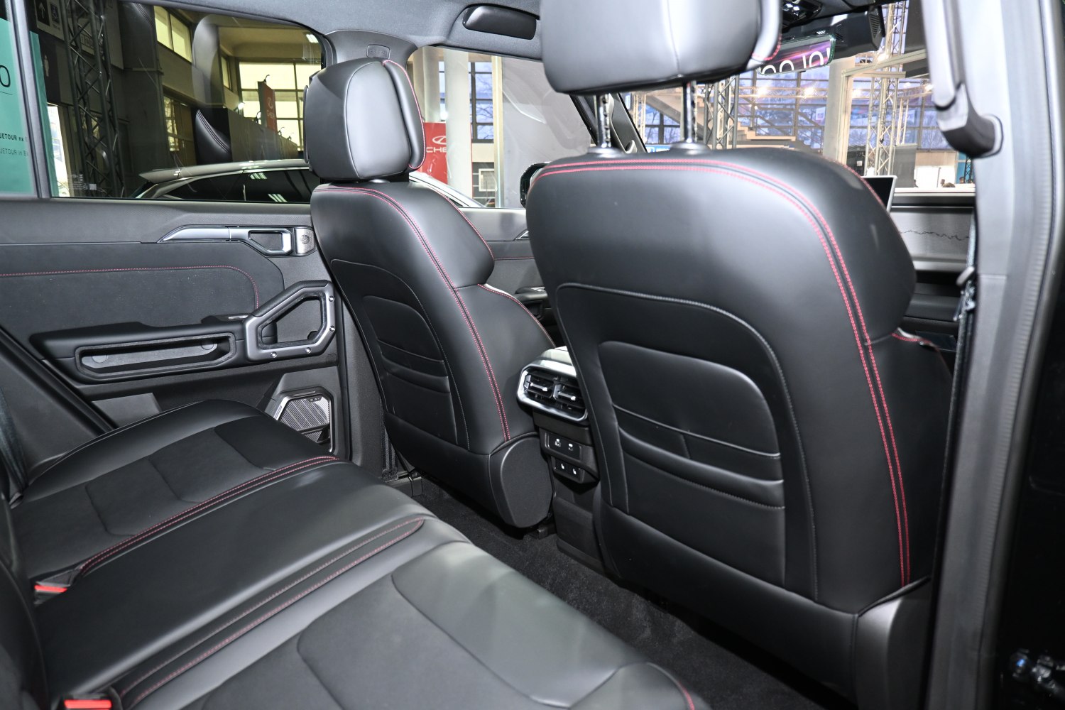 Black leather rear seats with red stitching and rear air vents