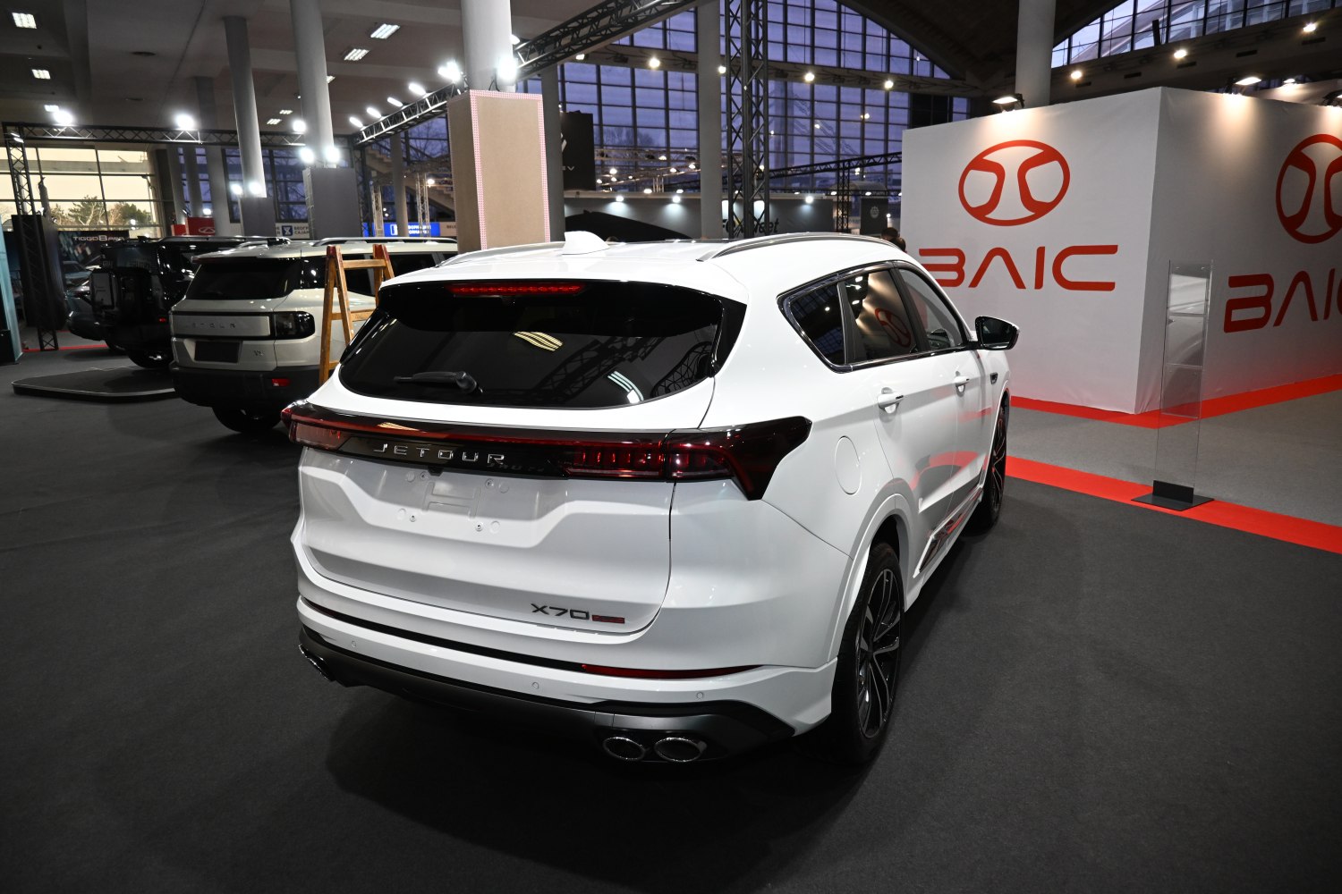 Sleek rear design with dual exhausts and integrated spoiler